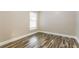 Cozy bedroom with wood floors and natural light streaming through the window at 2081 Galveston Ave, Deltona, FL 32725