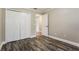 Bedroom featuring wood flooring, large closet, and neutral wall color at 2081 Galveston Ave, Deltona, FL 32725