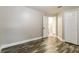 Bedroom showcasing hardwood floors, with a view of an ensuite bathroom at 2081 Galveston Ave, Deltona, FL 32725