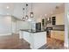 Modern kitchen featuring a center island, stainless steel appliances, and pendant lighting at 2081 Galveston Ave, Deltona, FL 32725