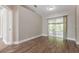 Bright living room with sliding glass doors leading to an outdoor patio at 2081 Galveston Ave, Deltona, FL 32725