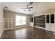 Spacious living room featuring vaulted ceilings, wood-look floors, and custom built-ins at 2081 Galveston Ave, Deltona, FL 32725