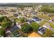 Bird's eye view of a community with various homes, trees, and neighborhood streets at 211 Dalton Dr, Kissimmee, FL 34758