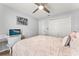 Comfortable bedroom with hardwood floors, a ceiling fan, a window, and a closet at 211 Dalton Dr, Kissimmee, FL 34758