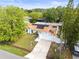 Attractive single-story home with solar panels, landscaping, and a long driveway at 211 Dalton Dr, Kissimmee, FL 34758