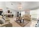 Inviting living room with tile flooring, stylish furnishings, and abundant natural light at 211 Dalton Dr, Kissimmee, FL 34758