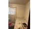 Cozy bedroom showcasing a twin bed and minimal furnishings near a window at 2207 Virginia Ave, Eustis, FL 32726