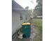 Exterior view of the home with garbage receptacles at 2207 Virginia Ave, Eustis, FL 32726
