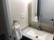 Bathroom featuring a white sink, modern faucet, and towel holder at 222 Georgetown Dr # C, Casselberry, FL 32707