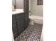 Bathroom showcasing updated vanity, decorative tile floor, and a bathtub at 222 Georgetown Dr # C, Casselberry, FL 32707
