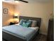 Comfortable bedroom featuring a ceiling fan, accent pillows, and neutral wall colors at 222 Georgetown Dr # C, Casselberry, FL 32707