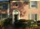 Charming townhouse with a brick facade, green shutters, and a well-maintained front entrance at 222 Georgetown Dr # C, Casselberry, FL 32707