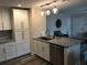 Stylish kitchen island with granite countertop, stainless steel dishwasher, and white cabinets, perfect for meal prep and entertaining at 222 Georgetown Dr # C, Casselberry, FL 32707