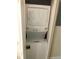 A stacked washer and dryer in a closet offer a space-saving laundry solution at 222 Georgetown Dr # C, Casselberry, FL 32707