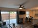 Bright and airy living room featuring sliding glass doors to the patio, a comfortable sofa, and modern decor at 222 Georgetown Dr # C, Casselberry, FL 32707