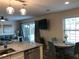 Living area with a view of the outdoor patio, adjacent to the kitchen and dining space, creating an open and airy feel at 222 Georgetown Dr # C, Casselberry, FL 32707