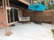 Patio with outdoor furniture, a blue umbrella, and a brown wooden fence at 222 Georgetown Dr # C, Casselberry, FL 32707