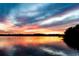 The sun sets over a lake with a beautiful display of colors at 222 Georgetown Dr # C, Casselberry, FL 32707
