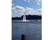 Person on a flyboard high in the air over the water, with a jet ski nearby at 222 Georgetown Dr # C, Casselberry, FL 32707