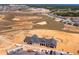 New construction aerial view showing the surrounding development, amenities, and nearby school at 2285 Mystic Maze Ln, Clermont, FL 34715