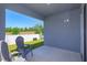 Covered back porch with peaceful views of the yard, creating a serene outdoor living space at 2285 Mystic Maze Ln, Clermont, FL 34715