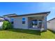 The home features a backyard with a covered patio, providing a wonderful outdoor experience at 2285 Mystic Maze Ln, Clermont, FL 34715