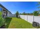 The fenced in backyard provides a safe space for and pets at 2285 Mystic Maze Ln, Clermont, FL 34715