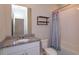 Modern bathroom features granite countertops, updated fixtures, and a shower-tub combination at 2285 Mystic Maze Ln, Clermont, FL 34715