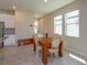 Bright dining area featuring modern furniture, large windows, and ample natural light at 2285 Mystic Maze Ln, Clermont, FL 34715