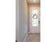 Bright foyer featuring tile flooring and a glass-paneled front door letting in natural light at 2285 Mystic Maze Ln, Clermont, FL 34715