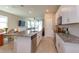 Modern kitchen featuring stainless steel appliances, granite countertops, and tile flooring at 2285 Mystic Maze Ln, Clermont, FL 34715