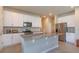 Stylish kitchen boasting white cabinetry, granite countertops, and stainless steel appliances at 2285 Mystic Maze Ln, Clermont, FL 34715