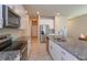 Modern kitchen features stainless steel appliances, granite countertops, and white cabinets at 2285 Mystic Maze Ln, Clermont, FL 34715