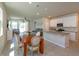 Inviting kitchen with white cabinets, granite countertops, stainless steel appliances and open concept layout at 2285 Mystic Maze Ln, Clermont, FL 34715