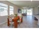 Comfortable living room with tile flooring, a ceiling fan, and sliding glass doors to the backyard at 2285 Mystic Maze Ln, Clermont, FL 34715