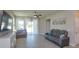 Comfortable living room with modern furniture and access to the outdoor patio at 2285 Mystic Maze Ln, Clermont, FL 34715