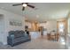 Open concept living room connected to the kitchen and dining area at 2285 Mystic Maze Ln, Clermont, FL 34715