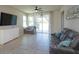 Bright living room with sliding glass doors and a comfortable seating area at 2285 Mystic Maze Ln, Clermont, FL 34715