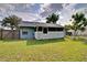 A backyard with a screened porch offers outdoor living space and protection from insects at 2516 Albury Ave, Deltona, FL 32738