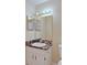 Bathroom vanity with a unique countertop and an illuminated mirror cabinet at 2516 Albury Ave, Deltona, FL 32738