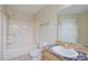 Bright bathroom featuring a shower-tub combo and a vanity with ample counter space at 2516 Albury Ave, Deltona, FL 32738
