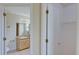 Well-lit bathroom doorway leading to a sink vanity and toilet at 2516 Albury Ave, Deltona, FL 32738