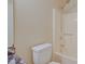 Bathroom with a toilet, shower, and marble-like countertop at 2516 Albury Ave, Deltona, FL 32738