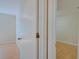 Bright bedroom featuring wood-look floors, neutral walls, and an open doorway at 2516 Albury Ave, Deltona, FL 32738
