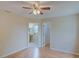 Bright bedroom with doors leading to the bathroom and walk-in closet at 2516 Albury Ave, Deltona, FL 32738