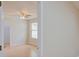 Cozy bedroom features hardwood floors, a ceiling fan, and a window with natural light at 2516 Albury Ave, Deltona, FL 32738