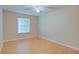 A well-lit bedroom featuring a window and ceiling fan at 2516 Albury Ave, Deltona, FL 32738