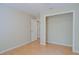 Vacant bedroom with hardwood floors and a closet, bathed in natural light at 2516 Albury Ave, Deltona, FL 32738