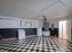 A garage with a black and white checkered floor, washer, dryer, refrigerator, and upper cabinets at 2516 Albury Ave, Deltona, FL 32738