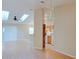 A bright, open floor plan connects the living room and kitchen with skylights and laminate floors at 2516 Albury Ave, Deltona, FL 32738